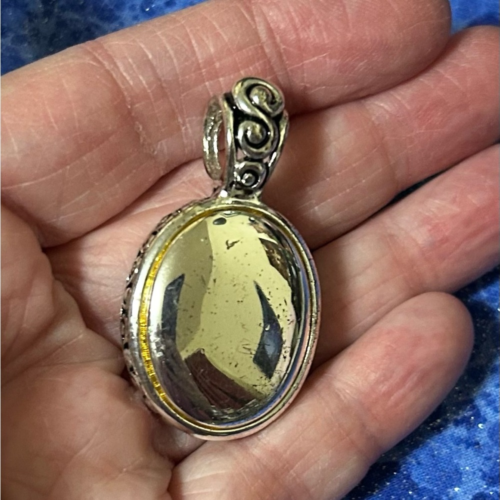 Silver tone pendant